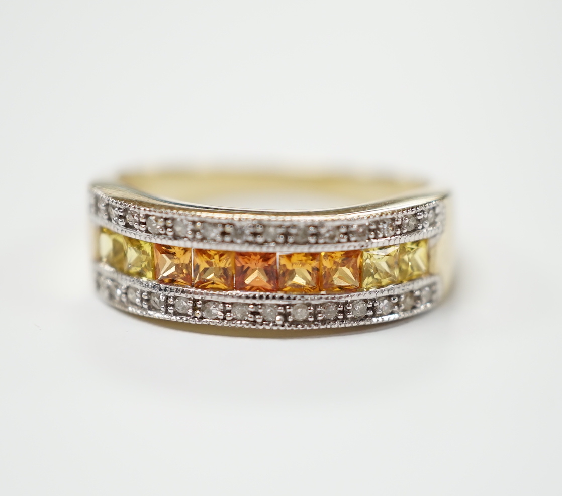A modern 9ct gold, diamond, and two colour citrine? channel set half hoop ring, size P, gross weight 3.3 grams.